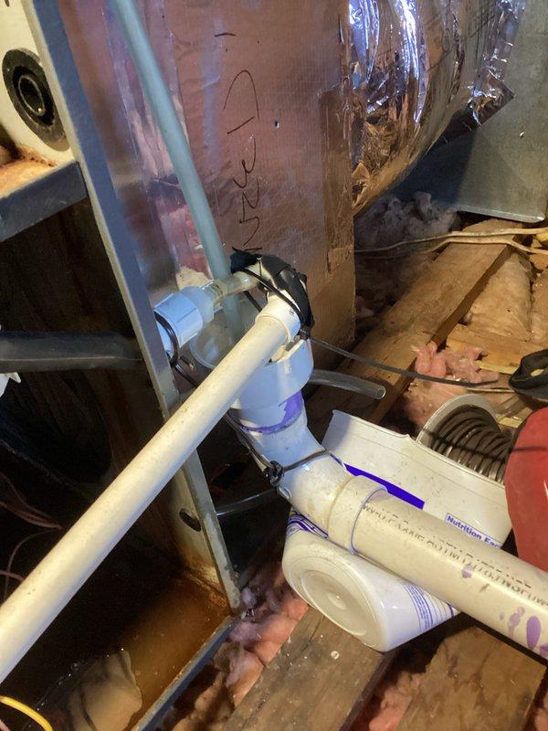 Performed routine tune-up on HVAC system located in attic space. Inspected PVC condensate drain piping and connections for proper installation and function. Examined furnace interior components including electrical connections and wiring. Verified proper installation of PVC exhaust/intake piping with appropriate markings. All components tested and confirmed to be operating within normal parameters.