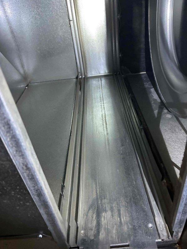 Performed scheduled prepaid HVAC maintenance inspection. Examined interior ductwork components for integrity, noting normal wear on galvanized metal surfaces. Inspected insulated ducting and verified proper sealing at connection points with temperature probe, observing appropriate insulation condition with no significant deterioration requiring immediate attention.