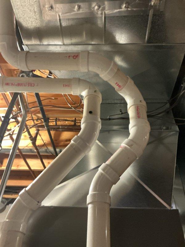 Performed seasonal tune-up on Lennox HVAC system. Inspected condensate drain assembly in attic and verified proper drainage with no blockages. Examined main unit in utility room, confirming all connections secure and system operating within manufacturer specifications.