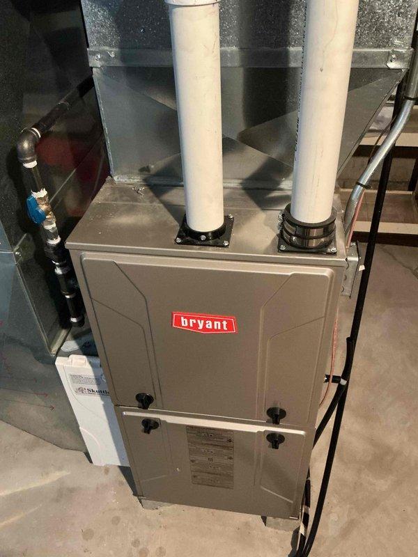 Performed routine tune-up service on Bryant furnace system located in utility area. Inspected PVC exhaust venting, ductwork connections, and checked all electrical components for proper operation. Used specialized tools to clean and adjust burner assembly, ensuring optimal combustion and system efficiency.