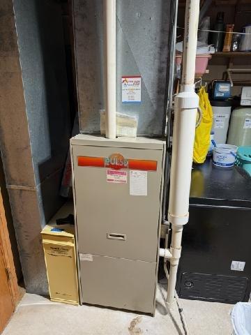 Responded to no-heat call for Ruud furnace system installed in basement. Visual inspection revealed condensate drainage issue in the PVC pipe assembly connected to the furnace. Cleared blockage in condensate line and verified proper drainage. System tested through complete heating cycle with proper operation restored.