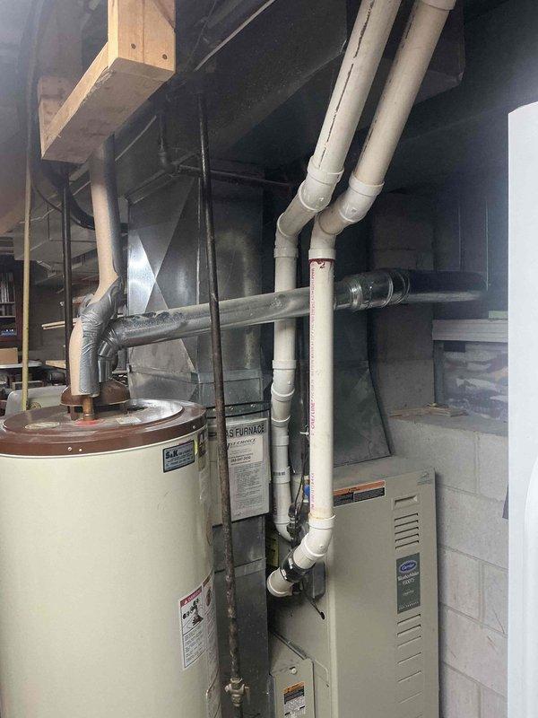 Conducted comprehensive inspection of residential HVAC system including furnace unit and associated ductwork in basement utility room. Evaluated system components for dust accumulation, airflow restrictions, and potential contamination sources. Recommended standard duct cleaning service to improve system efficiency and indoor air quality.