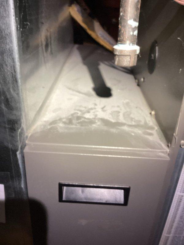 Responded to service call regarding water accumulation on furnace unit. Inspection revealed condensation buildup on the evaporator coil. Cleaned condensate drain line, which was partially blocked, and verified proper drainage. Visual inspection of ductwork showed no issues with insulation or airflow.