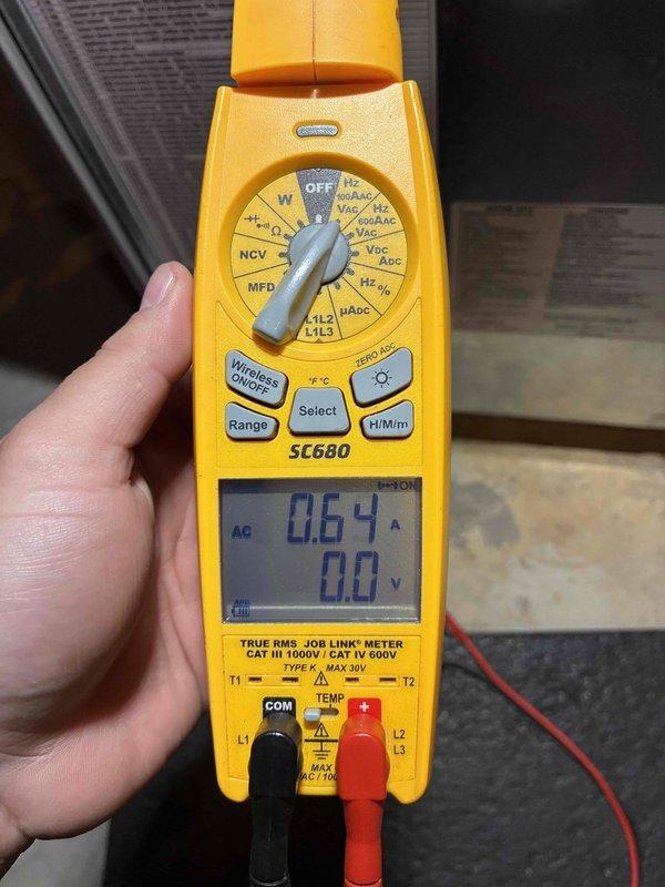 Performed comprehensive HVAC system tune-up including inspection of Honeywell control module. Identified and cleaned significant dust accumulation on components that could affect system efficiency. Conducted electrical diagnostics using clamp meter, confirming low amperage draw of 0.64A, indicating proper electrical operation within manufacturer specifications.
