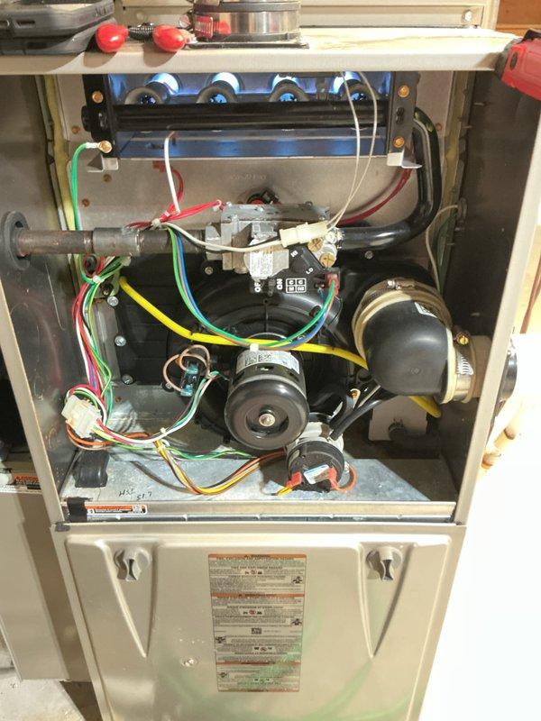 Performed scheduled maintenance on residential HVAC system. Conducted temperature differential testing with readings of 119.6°F at supply plenum, confirming proper heat exchange operation. Inspected blower assembly, electrical connections, and flame tubes - all components functioning within normal parameters with minor dust accumulation noted.