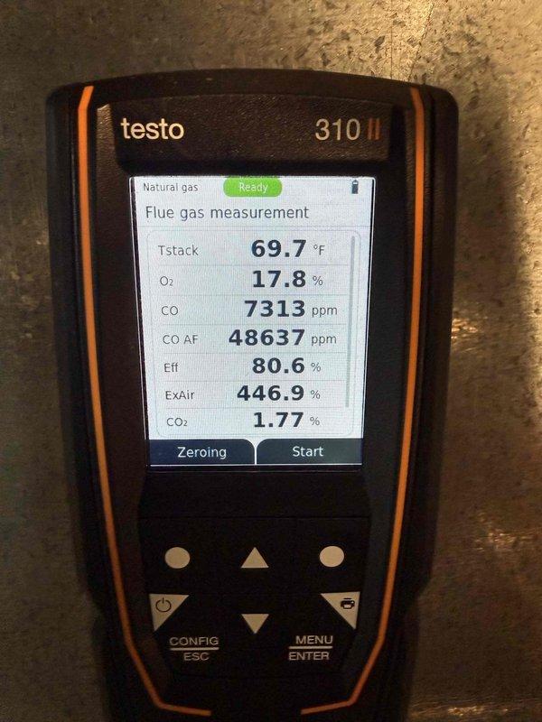 Performed a routine tune-up on the HVAC system and discovered significant CO readings (7313 ppm) during combustion analysis with the Testo 310 II. Identified water accumulation at the unit base indicating possible condensate drainage issue. System efficiency measured at 80.6% with high excess air (446.9%) and low CO₂ (1.77%), suggesting combustion problems requiring immediate attention to ensure safe operation.