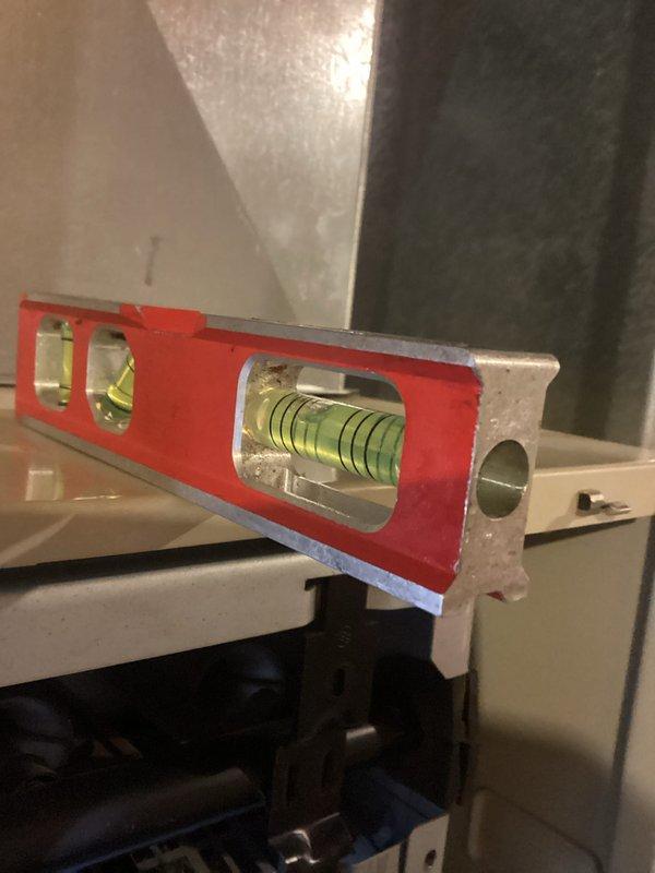 Performed comprehensive HVAC tune-up including inspection of ductwork and plumbing connections in utility space. Verified proper leveling of equipment using calibrated spirit level to ensure optimal system operation and efficiency.