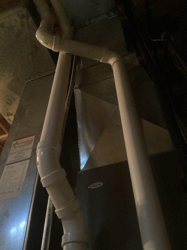 Performed routine maintenance on Lennox EL296UH070XE36B-02 furnace system. Inspected PVC venting configuration and connections for proper sealing. Checked electrical wiring and plumbing components, confirming all connections are secure and functioning correctly.