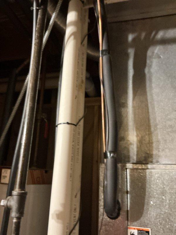 Performed comprehensive inspection of HVAC system in mechanical space, examining refrigerant lines, condensate drainage pipes, and associated ductwork connections. Inspected insulation material condition around refrigerant lines, noting proper installation with no visible damage or deterioration that could affect system efficiency.