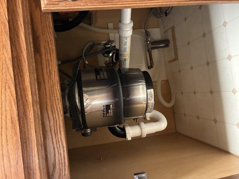 Inspected and serviced garbage disposal unit under kitchen sink. Verified connections to PVC drain system were secure and properly aligned. Confirmed unit was functioning correctly with no signs of leaks, damage or deterioration to any components.