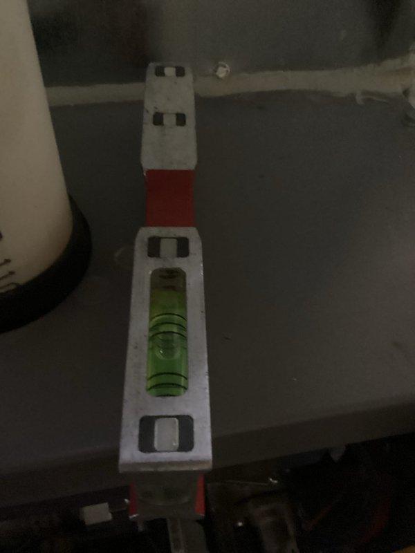 Performed comprehensive HVAC tune-up and inspection of system. Verified level installation of critical components using precision spirit level. Inspected PVC condensate drainage piping and connections to ensure proper installation within the mechanical infrastructure, confirming all components were correctly secured to building framework.