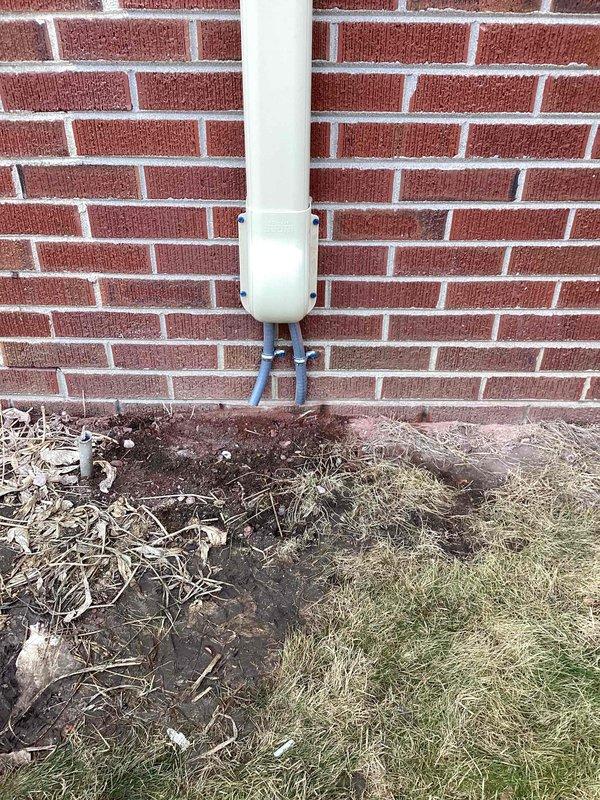 Installed mini-split system with proper pressure testing using Fieldpiece diagnostic tool, confirming system charge at 45.1 PSI. Completed condensate line installation with PVC downspout connection and drainage tubes directed away from building foundation to prevent moisture issues.