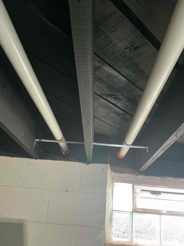 Successfully installed a new tankless water heater on concrete block wall with proper venting and plumbing connections. Installed copper supply lines with mounting brackets and connected PVC exhaust venting to existing system. Completed gas line connection and performed operational testing to verify proper functionality.