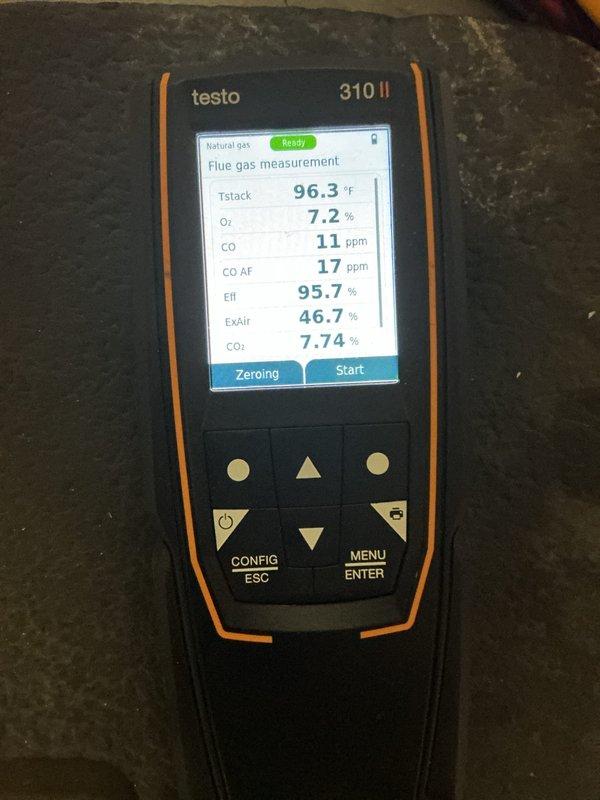 Performed annual maintenance on dual heating system. Conducted combustion analysis using Testo 310 II on natural gas unit, which showed excellent efficiency (95.7%) with proper CO levels (11 ppm) and good air/fuel mixture (CO₂ at 7.74%). Inspected complete installation including ductwork, PVC venting, and electrical connections - all components functioning within normal parameters.