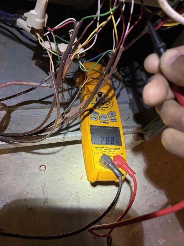 Performed routine HVAC tune-up including electrical system diagnostics with voltage readings measuring 288V on primary components. Discovered heavily soiled air filter during inspection and replaced with new filter to improve system efficiency and airflow.