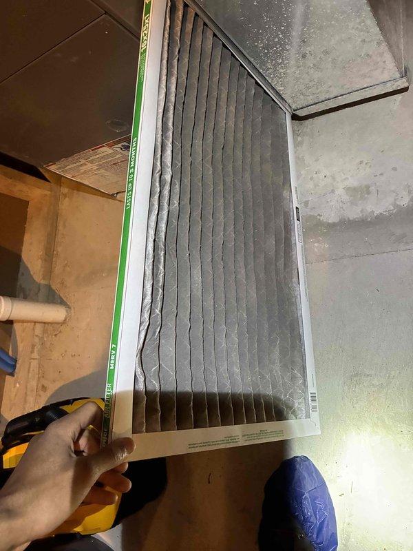 Performed routine HVAC tune-up including electrical system diagnostics with voltage readings measuring 288V on primary components. Discovered heavily soiled air filter during inspection and replaced with new filter to improve system efficiency and airflow.