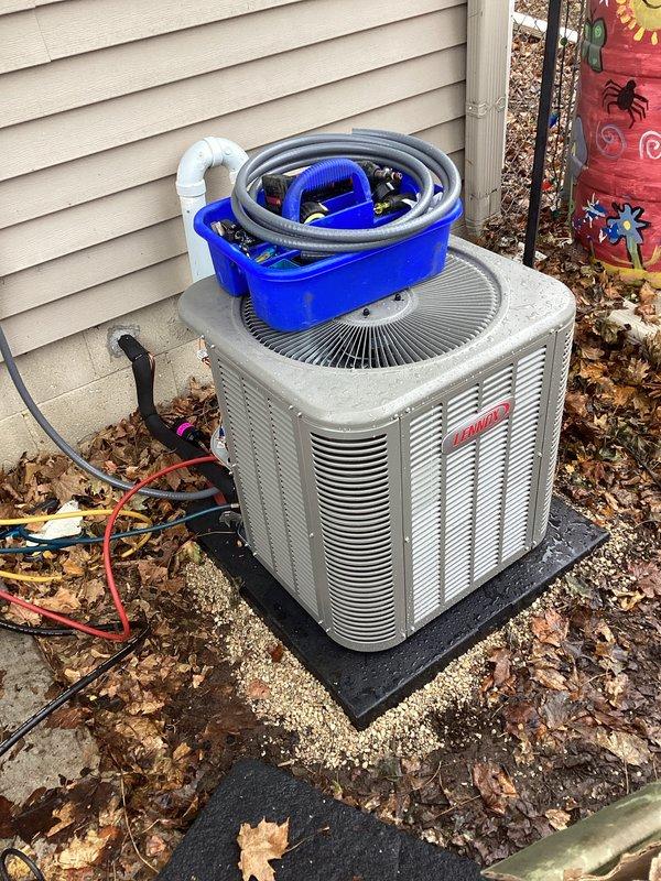 Completed installation of a new Lennox air conditioning system, including proper mounting of the outdoor condensing unit on a level pad adjacent to the home's exterior. Installed PVC condensate drain line with appropriate U-trap configuration and connected all electrical components via conduit to ensure code compliance. System was pressure tested, evacuated, and charged according to manufacturer specifications.