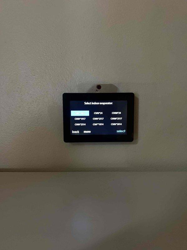Successfully installed a complete HVAC system with a digital control interface mounted on the wall, providing user-friendly access to multiple evaporator options including models CNPV1917, CNPV2M, CNPV2517, CNPV2514, CIV1814, and CNPV3014. System was properly integrated with the existing water heater and utility infrastructure, with all copper lines neatly bundled and secured for optimal performance and aesthetics.