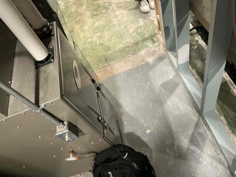 Completed installation of a new air handler/furnace unit with PVC drainage system in utility space. Unit was properly secured with mounting brackets and connected to existing ductwork. All connections were verified and system was tested to ensure proper operation.