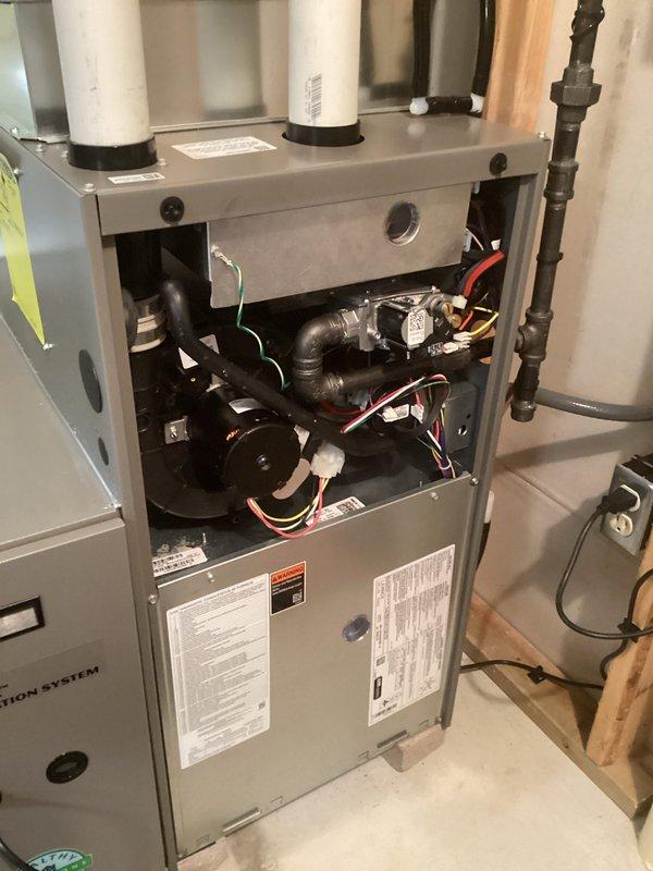 Performed comprehensive inspection of residential furnace system, accessing interior components to evaluate blower motor assembly, electrical connections, and exhaust ventilation. Visual inspection confirmed proper installation of all components with no signs of damage, abnormal wear, or operational issues. System was returned to service in normal working condition with all safety features verified.