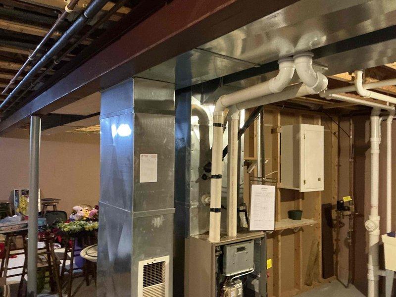 Conducted comprehensive assessment of basement HVAC system, including air handler unit and associated ductwork. Inspected electrical panel to verify proper circuit capacity for HVAC equipment, noting dedicated circuits for furnace and AC. Documented current installation configuration with photos to facilitate accurate replacement estimate.