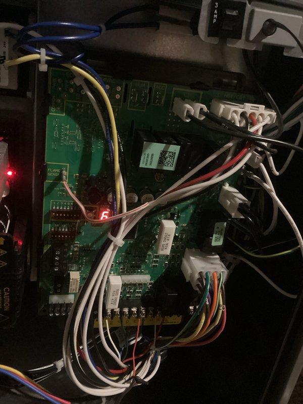 Responded to No Heat call for furnace under 10 years old. Inspected control board and found fault code 5 illuminated on LED display. Removed access panel to examine internal components and verified proper wire connections to PCB. Reset system and confirmed proper operation with normal flame sequence and heat output restored.