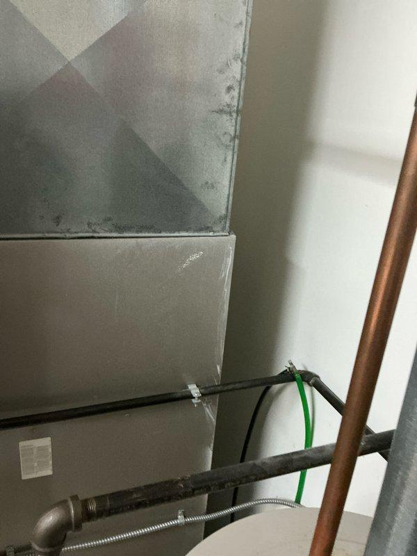 Performed comprehensive evaluation of existing Carrier WeatherMaker 9200 furnace system. Documented current installation configuration including PVC ventilation/drainage components and existing ductwork connections. Prepared detailed replacement estimate for complete HVAC system upgrade based on observed specifications and structural requirements of the utility room installation.