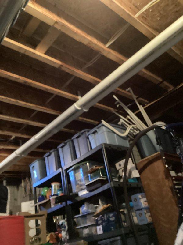 Conducted visual inspection of basement utility area containing furnace system. Examined exposed PVC vent piping and drainage components for proper installation and function. No active issues were identified with the heating system during this routine service call.