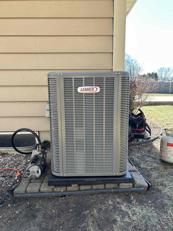 Successfully installed a new Lennox outdoor air conditioning unit on a paver pad foundation adjacent to the residence, with proper connection of refrigerant lines and electrical components. Interior work included installation of a matching evaporator coil in the air handler cabinet with all necessary connections secured and tested for optimal system performance.