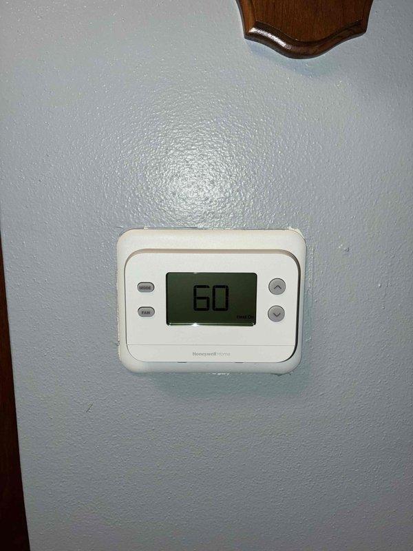 Performed warranty inspection of Lennox furnace system with connected Honeywell Home thermostat. Verified proper installation of PVC exhaust/intake pipes and confirmed thermostat functionality at 60°F setpoint. Documented system condition with photos for warranty records.