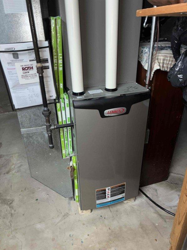 Performed warranty inspection of Lennox furnace system with connected Honeywell Home thermostat. Verified proper installation of PVC exhaust/intake pipes and confirmed thermostat functionality at 60°F setpoint. Documented system condition with photos for warranty records.