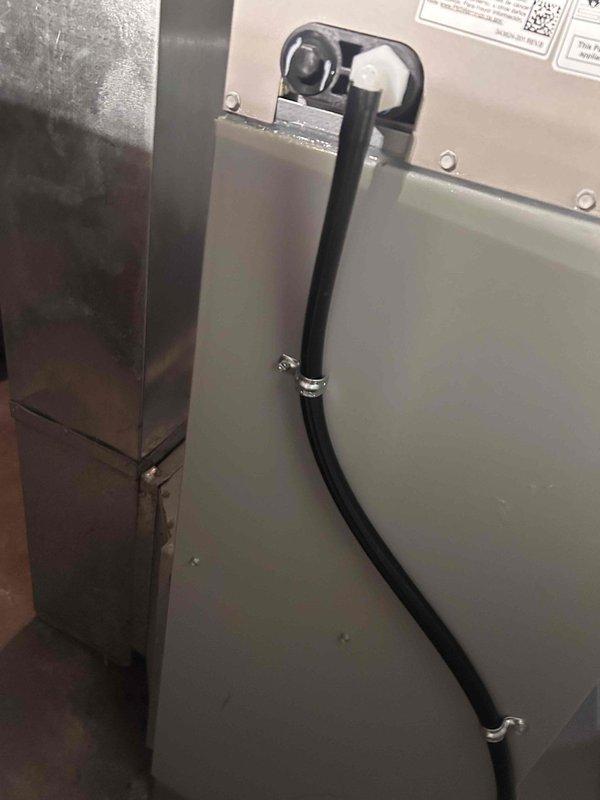 Completed installation of new A/C unit with matching evaporator coil, including proper connection of refrigerant lines with appropriate fittings and filter drier. System was properly secured to existing ductwork in utility area, with condensate drain line installed for proper moisture removal.