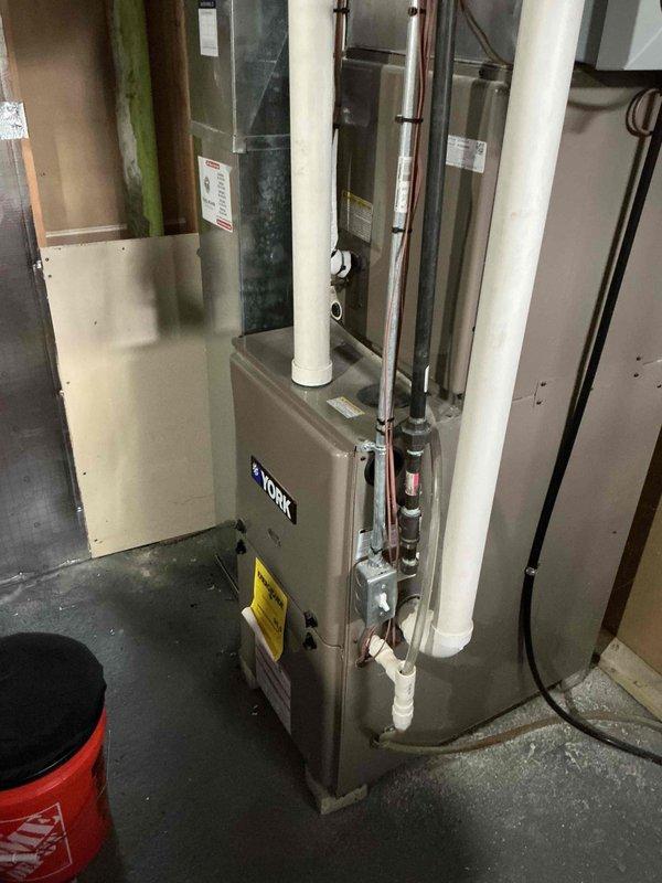 Performed routine maintenance on York furnace system including inspection of heat exchanger, combustion components, and ventilation pathways. Examined PVC intake/exhaust venting pipes and verified proper connections with no visible damage or blockage. Inspected condensate drain lines and insulated ductwork for proper installation and function.