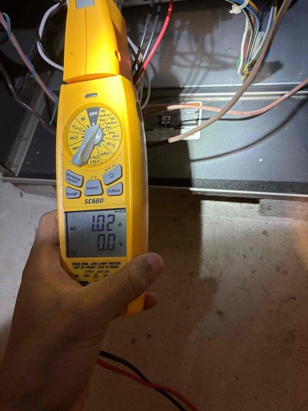Conducted routine HVAC tune-up service including inspection of refrigerant ports and connections at the service valve assembly. Performed electrical diagnostics using multimeter, verifying proper voltage readings of 10.2V across control circuit components and confirming system is operating within manufacturer specifications.