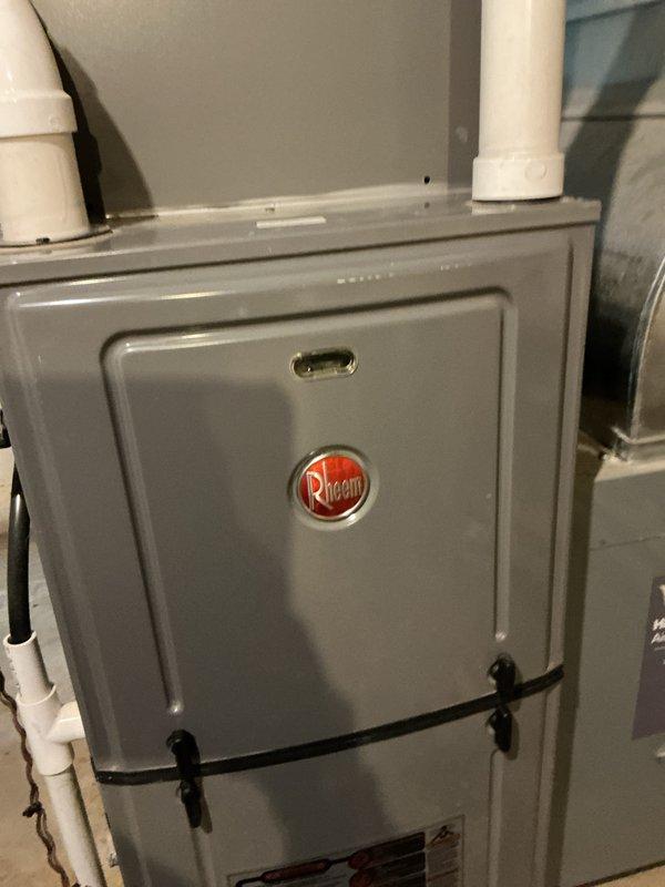 Performed routine maintenance on Rheem HVAC system as part of prepaid maintenance visit. Inspected furnace components, connections, and ventilation system including the PVC exhaust pipes. Identified and reinforced pipe joint connection with appropriate sealant to prevent potential leaks in the utility area plumbing infrastructure.