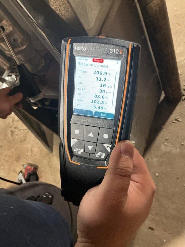 Responded to no heat complaint on 10+ year old system. Performed combustion analysis with Testo 310 which revealed suboptimal efficiency (5.49%) and concerning CO levels. Discovered significant cracking in the flue pipe causing potential exhaust gas leakage. Replaced damaged flue section to restore proper venting and system safety.