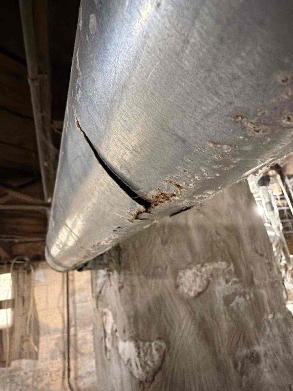 Responded to no heat complaint on 10+ year old system. Performed combustion analysis with Testo 310 which revealed suboptimal efficiency (5.49%) and concerning CO levels. Discovered significant cracking in the flue pipe causing potential exhaust gas leakage. Replaced damaged flue section to restore proper venting and system safety.