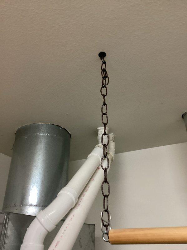 Completed installation of a new furnace system in the utility area, connecting the unit to existing ductwork with PVC venting. Properly secured all components, including the metal ductwork and PVC pipe connections, and verified proper clearance between the furnace and adjacent water heater.