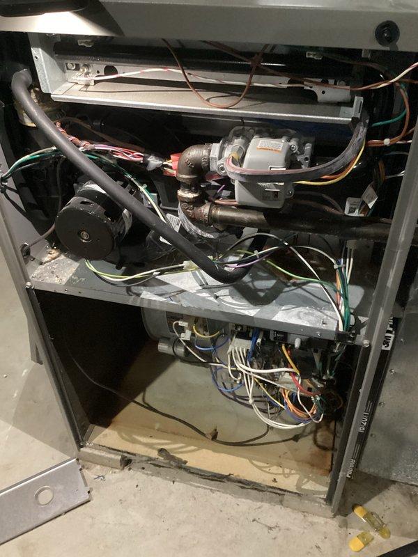 Performed comprehensive tune-up on residential HVAC system, including inspection of interior components (control board, wiring harnesses, gas valve, and motor assembly) and verification of proper PVC venting installation in basement mechanical area. All components showed normal operational wear with no significant issues detected; system is functioning within manufacturer specifications.