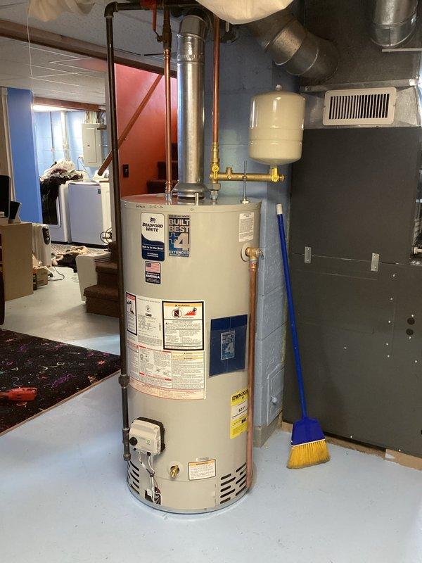 Successfully installed a new Premier Plus water heater in the basement utility room, including proper connection of copper plumbing lines and installation of an expansion tank. Ensured proper venting with metal exhaust pipe and verified all connections were secure and leak-free before completing the installation.