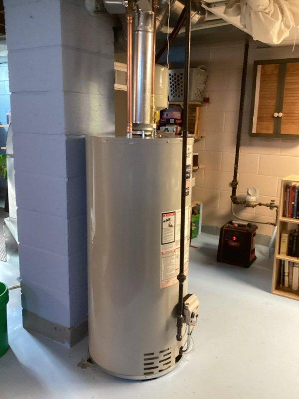 Successfully installed a new Premier Plus water heater in the basement utility room, including proper connection of copper plumbing lines and installation of an expansion tank. Ensured proper venting with metal exhaust pipe and verified all connections were secure and leak-free before completing the installation.