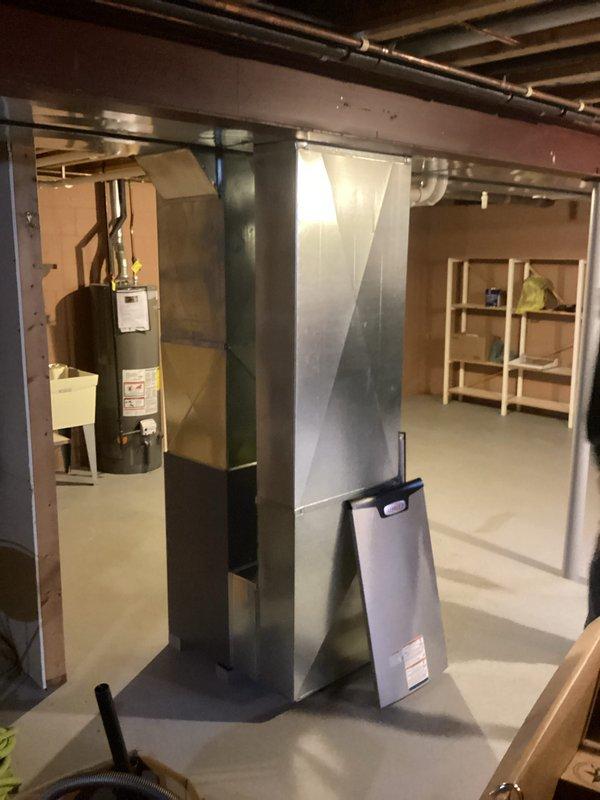Successfully completed installation of a new furnace system in basement mechanical room, including proper connection of all ductwork and PVC venting components. Unit was secured on concrete floor with appropriate clearances from water heater and other utilities, and all manufacturer specifications were followed during setup and testing.