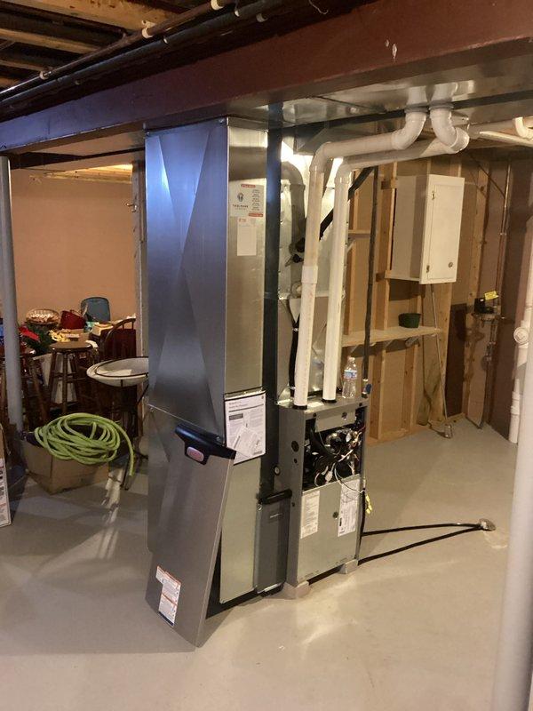 Successfully completed installation of a new furnace system in basement mechanical room, including proper connection of all ductwork and PVC venting components. Unit was secured on concrete floor with appropriate clearances from water heater and other utilities, and all manufacturer specifications were followed during setup and testing.