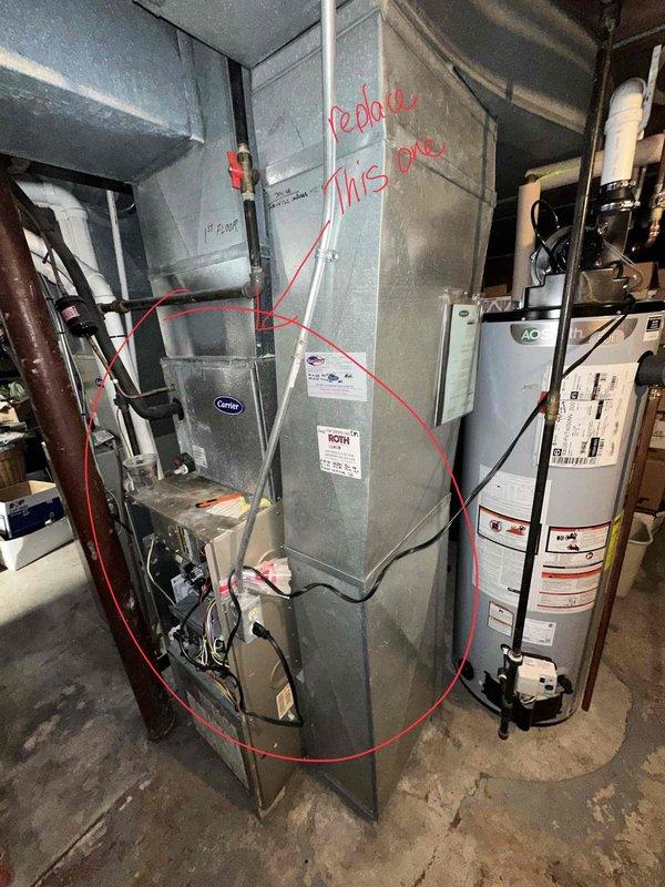 Conducted visual inspection of existing Carrier HVAC system and identified furnace component requiring replacement. Documented current installation configuration including ductwork connections and proximity to water heater. Prepared estimate for replacement of marked furnace component to restore system to proper operating condition.