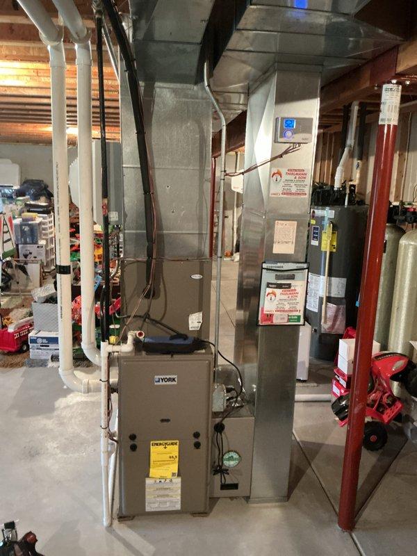 Performed comprehensive tune-up service on York furnace system located in basement mechanical room. Inspected all ductwork connections, PVC condensate drainage, and verified proper installation of equipment. System was found to be in normal operating condition with no visible issues requiring immediate attention.