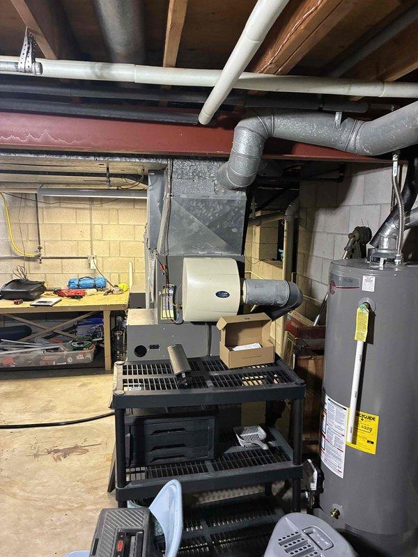 Conducted full assessment of existing HVAC system, including interior furnace unit with attached humidifier and exterior Lennox condensing unit. Prepared comprehensive replacement estimate for complete system upgrade, noting the current installation's age and configuration within the basement mechanical area and outdoor protective enclosure.