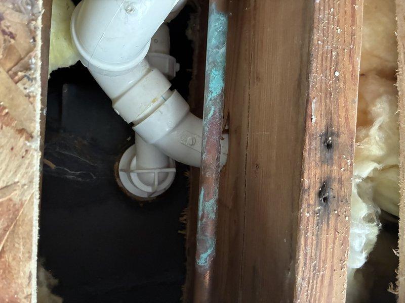 Responded to service call to address drainage issue. Discovered significant mineral buildup and sediment accumulation in the 1½" polyethylene pipe fittings of the residential plumbing system. Removed affected section, cleaned pipe connections, and replaced damaged components to restore proper drainage function.