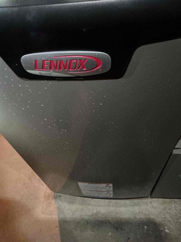Performed routine tune-up service on Lennox HVAC system. Conducted temperature differential testing with readings of 118.4°F, confirming proper system operation. Unit cabinet showed normal dust accumulation consistent with standard operation; cleaned exterior surfaces during service.