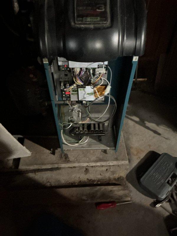 Completed annual maintenance service on NTI water heating system and furnace unit. Inspected internal electrical components, control board connections, and checked all plumbing connections including PVC ventilation and copper supply lines for proper operation. System is functioning within normal parameters after service.