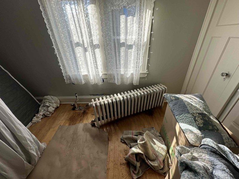 Conducted site assessment for radiator replacement in two rooms undergoing renovation. Current cast iron radiator system is outdated and will be replaced with modern high-efficiency units to improve heating performance while complementing the ongoing interior remodeling work. Recommended complete removal of existing radiators and installation of new system with updated piping connections.